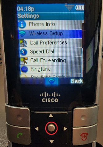 Picture of the Cisco WIP310 cordless phone with a circle highlighting the Select button, but also showing the Wireless Setup menu option being highlighted