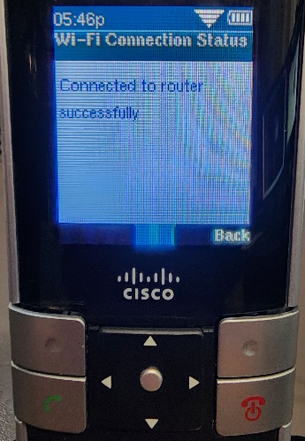 Picture of the Cisco WIP310 cordless phone showing the Wi-Fi Connection Status screen, and the message 'Connected to router successfully'