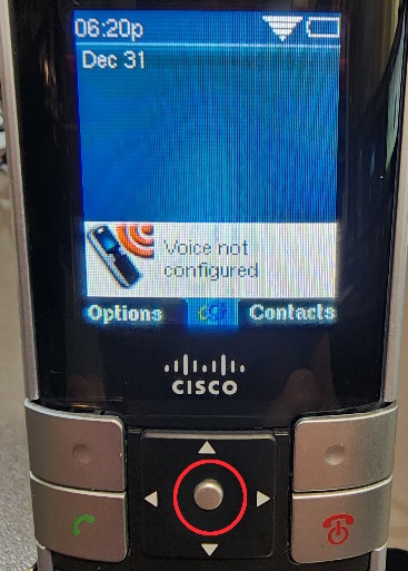 Picture of the Cisco WIP310 cordless phone with a circle highlighting the Select button, but also showing the message 'Voice not configured'